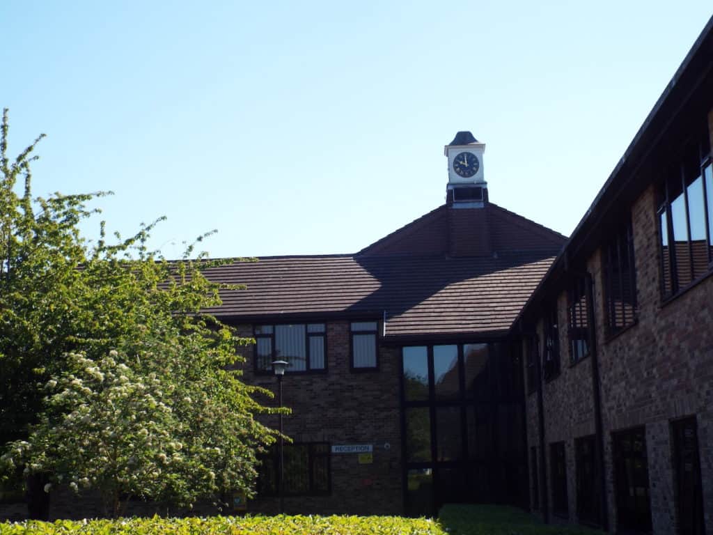 brown council office building with trees