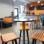 inside of cafe with orange chairs
