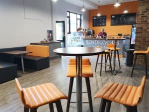 inside of cafe with orange chairs