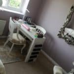 Interior of beauty salon with mirror and chair