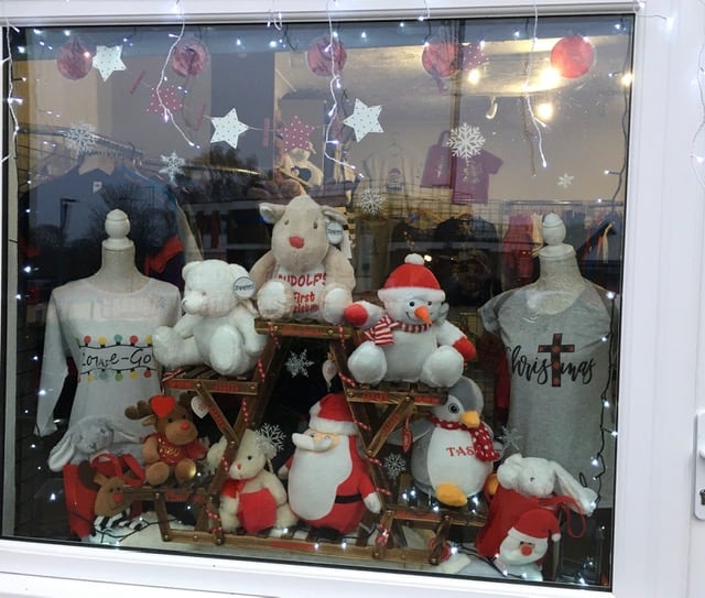 red and white festive display with snowman