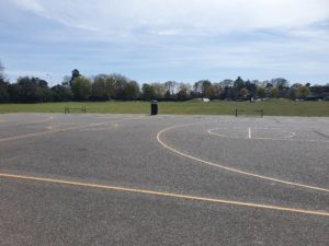 grey floor with yellow basketball markings