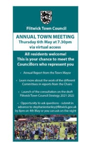 blue poster advertising the annual town meeting on thursday 6th may