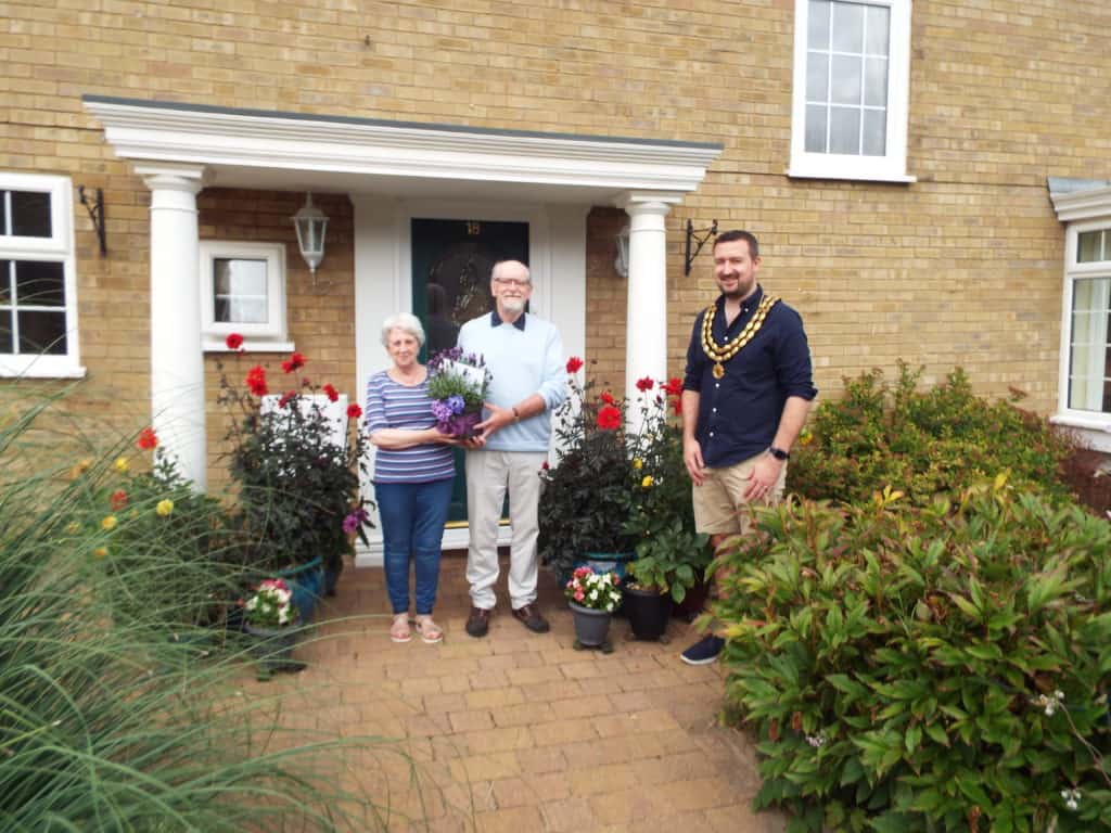 mayor and two winners outside the house - winners