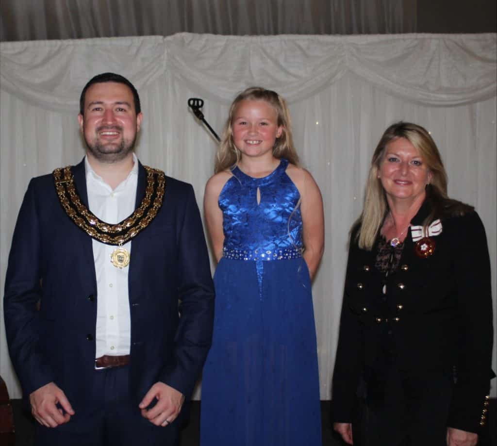 Mayor, young girl and lady at the civic reception