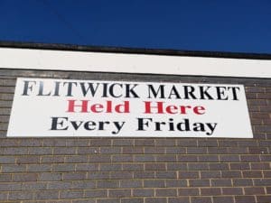 black and red market sign