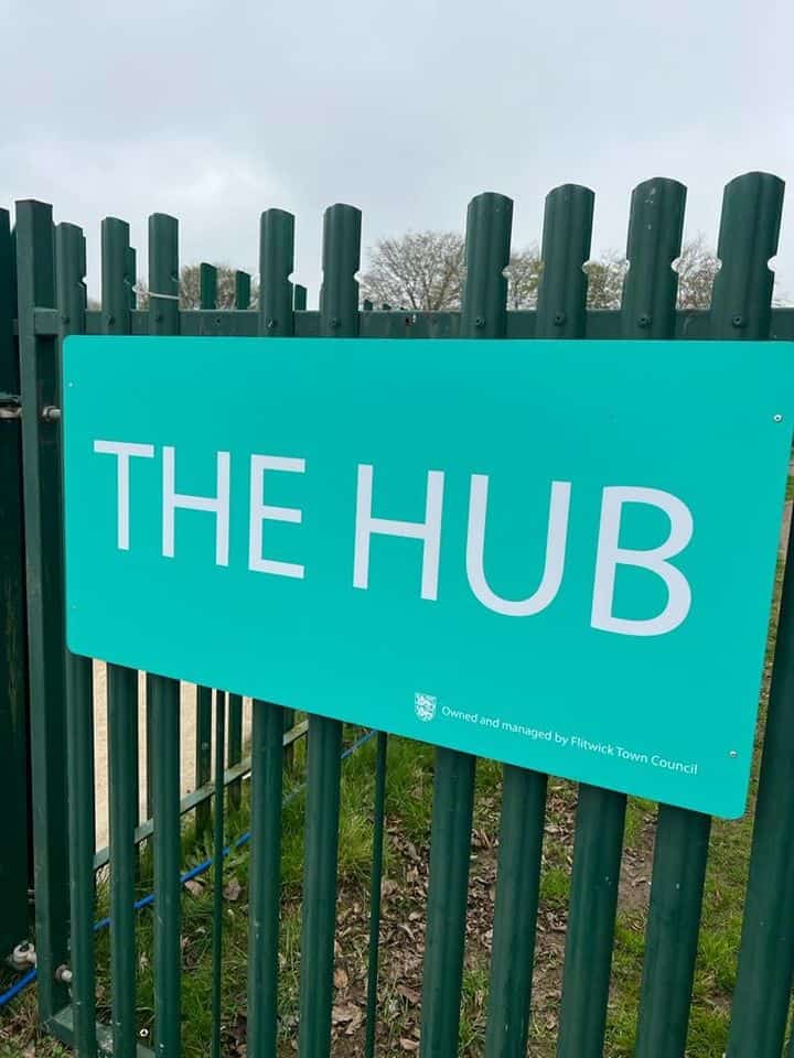 blue sign for The Hub building