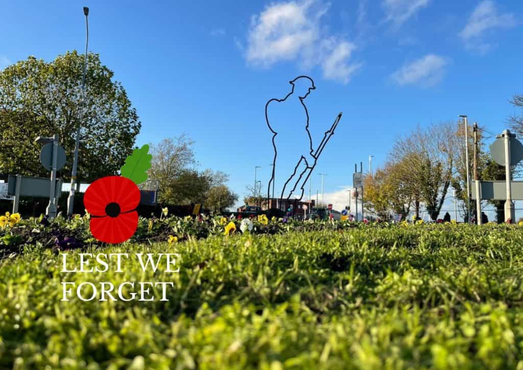 roundabout with soldier statue and poppy for remembrance day