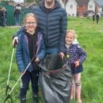 people with litter picks