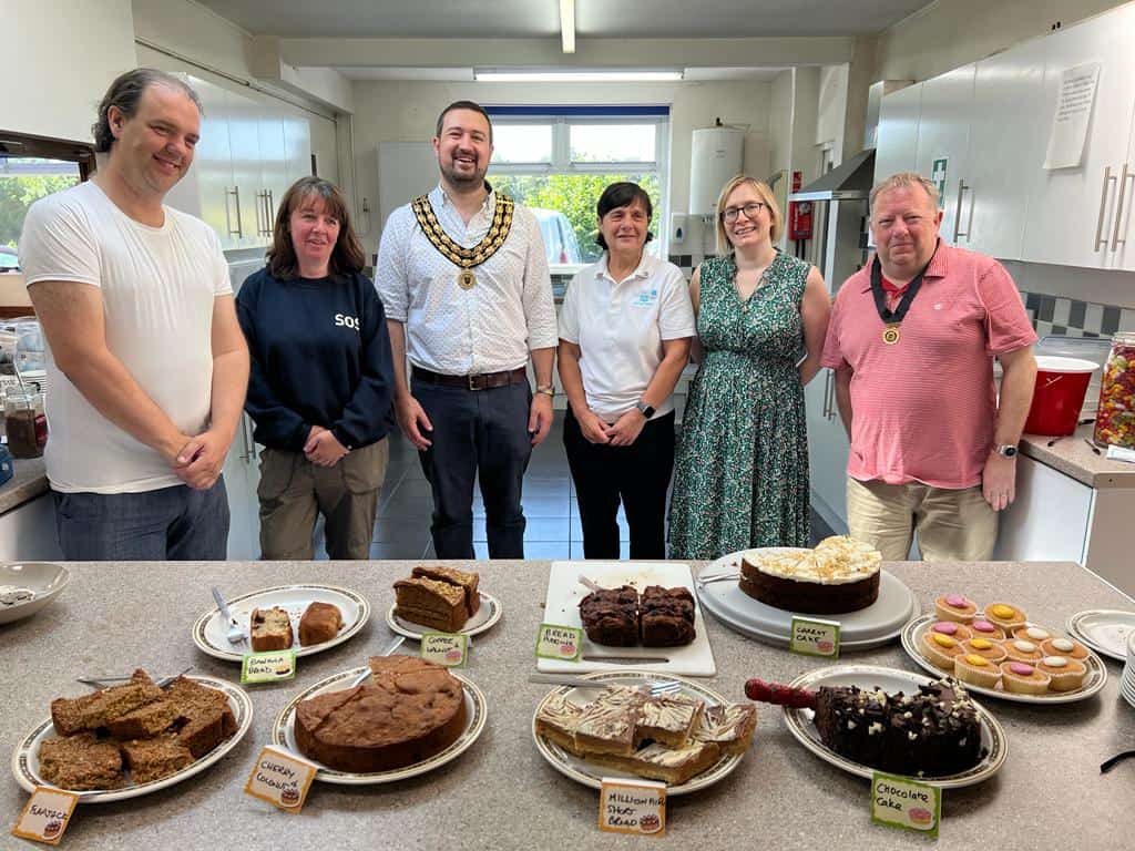 group of people at cake stall