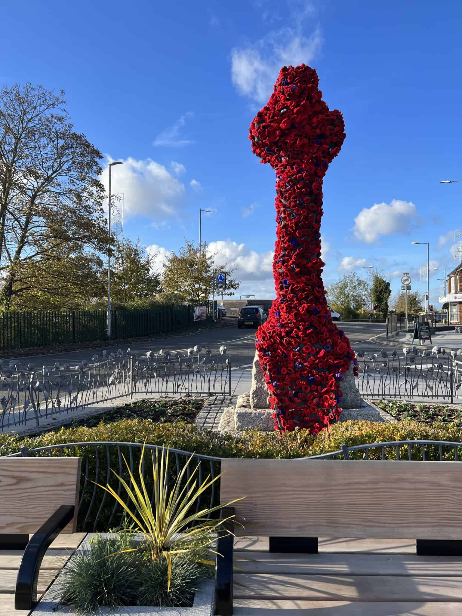 war memorial covered in knitted poppies