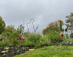 soldier statue with knitted poppies in centre of roundabout