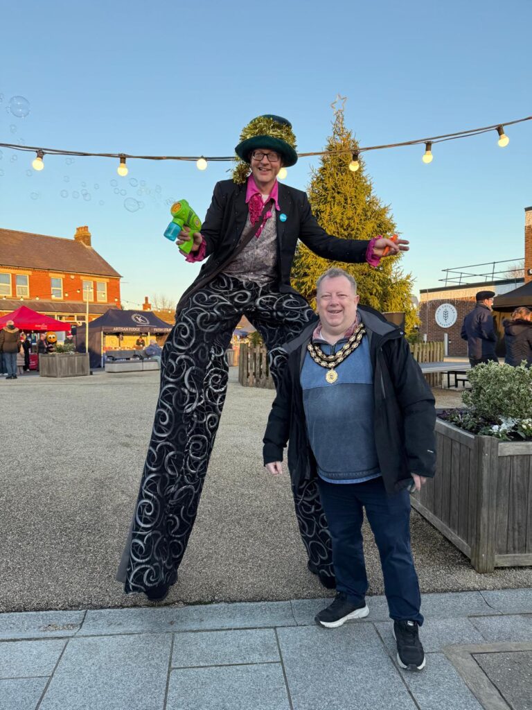 Photo of the Town Mayor at the Christmas lights switch on.